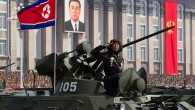 A North Korean soldier salutes atop his