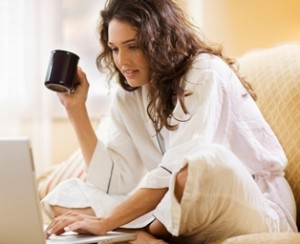 Woman working at home with laptop computer