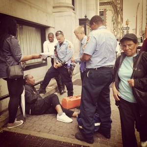 Baltimore firefighters and police rush to help a homeleass man in need